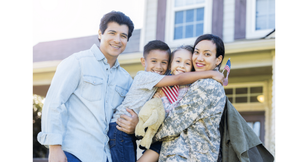 Military Family standing in front of their off base housing