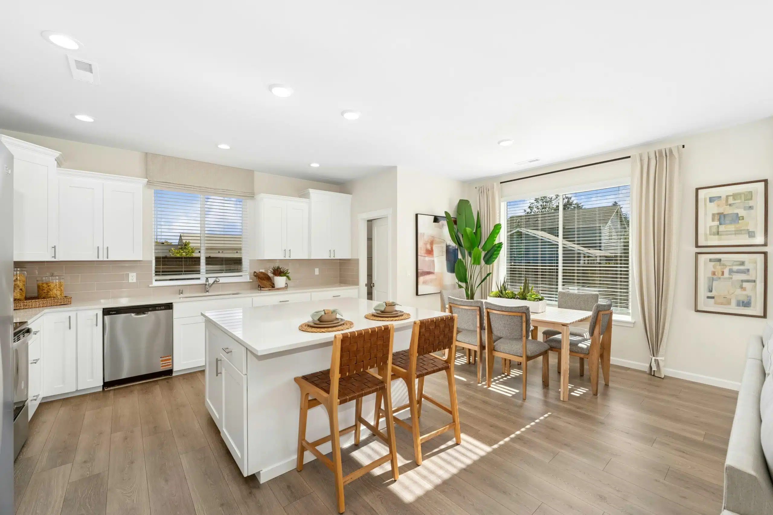 Kitchen/dining area with 2-seat island and 6-seat table overlooking the backyard.